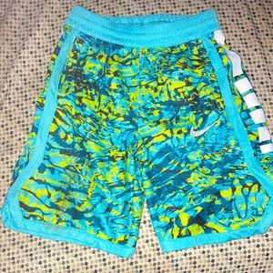 Woman’s green blue and white  Nike shorts size medium brand is DRI -FIT